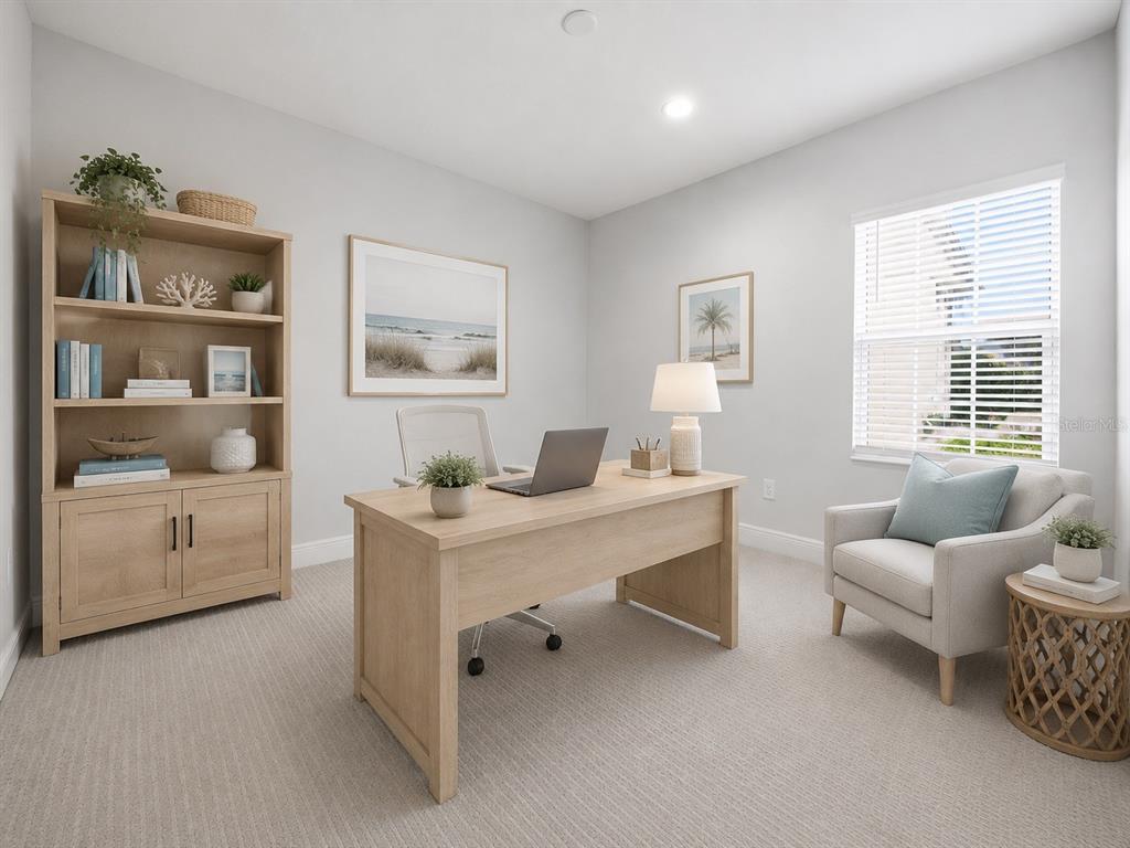 A home office featuring a light wood desk, matching bookshelf, and an armchair by the window — 11118 SAND PINE LANE, PARRISH, FL