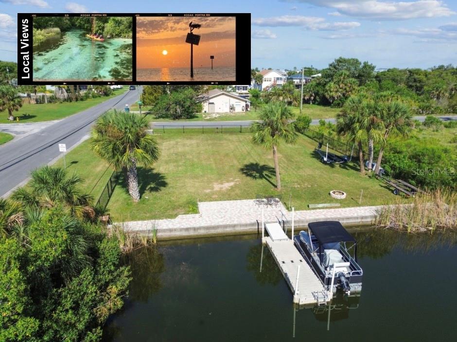 An aerial view of a waterfront lot featuring a private dock, boat, and grassy yard — 3314 FERNLEAF DRIVE, HERNANDO BEACH, FL