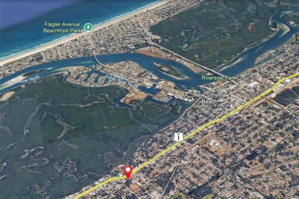 This is an aerial map view of New Smyrna Beach, Florida, showing the surrounding waterways — 1042 N DIXIE FREEWAY, NEW SMYRNA BEACH, FL
