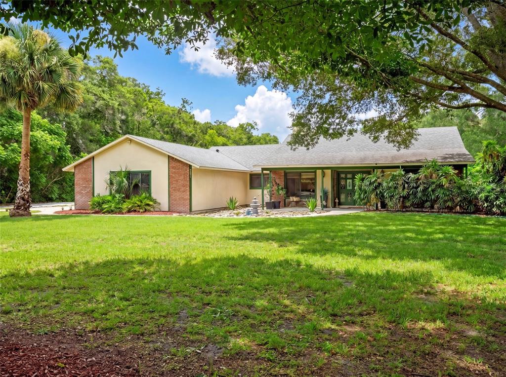 A single-story house with a three-car garage, a detached garage, and a concrete driveway — 3501 HILL STREAM AVENUE, APOPKA, FL