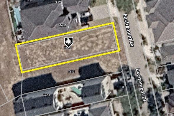 An aerial view shows a house with a swimming pool and a red location marker — 7615 EXCITEMENT DRIVE, REUNION, FL