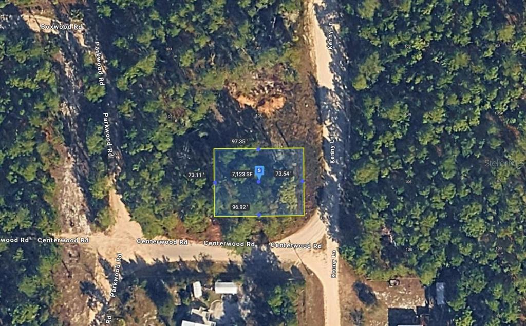 An aerial map shows a rectangular plot of land highlighted in yellow near a road intersection — CENTERWOOD ROAD, FLORAHOME, FL