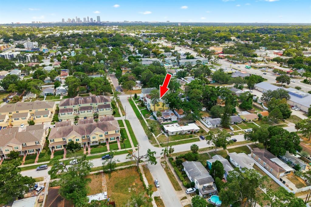 A yellow two-story house with a front porch and a green lawn — 4920 3RD STREET N, ST PETERSBURG, FL