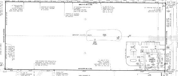 This is a land survey map showing a property boundary, building footprint, and parking lot — 2275 N VOLUSIA AVENUE, ORANGE CITY, FL