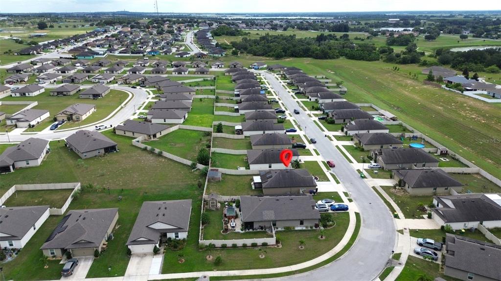 An aerial view shows a residential neighborhood with a red pin marking a specific house — 1552 SWAN LAKE CIRCLE, DUNDEE, FL