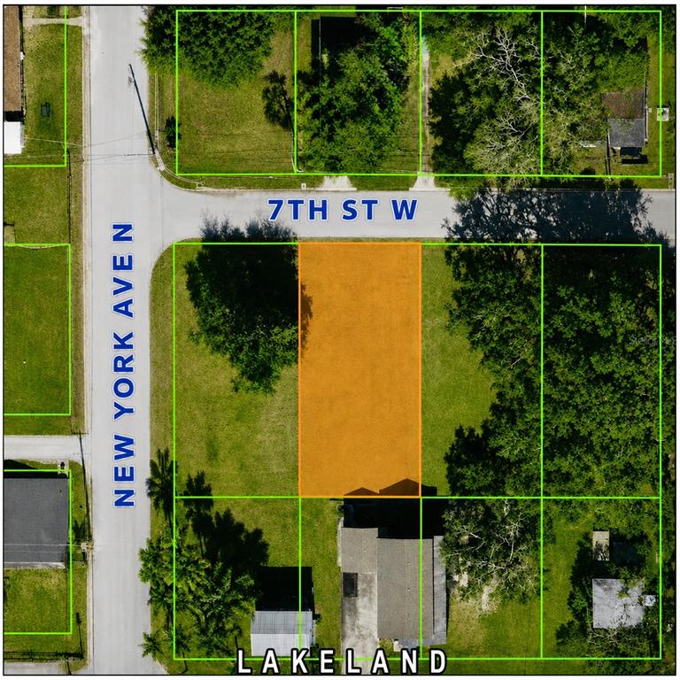 This is an aerial map showing a vacant orange-highlighted lot at a street intersection — 210 W 7TH STREET, LAKELAND, FL