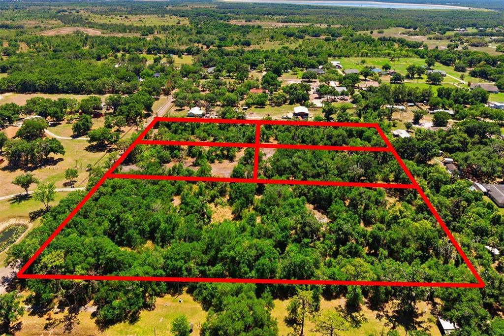 An aerial view shows several large houses on expansive, wooded lots outlined in red — 19084 RED BIRD LANE LOT 4, LITHIA, FL