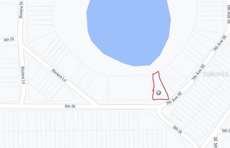 This map shows a highlighted vacant lot located near a lake and residential streets — 00 7TH AVENUE, INTERLACHEN, FL