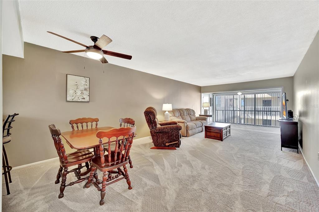 An aerial view shows waterfront apartment buildings with swimming pools and boat docks — 113 ISLAND WAY UNIT 241, CLEARWATER BEACH, FL