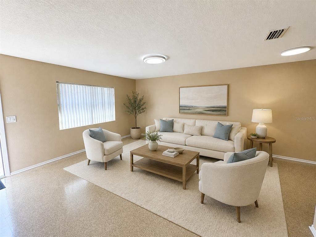 A living room features a beige sofa, two armchairs, a coffee table, and a rug — 5222 BOGDONOFF DRIVE, SEFFNER, FL