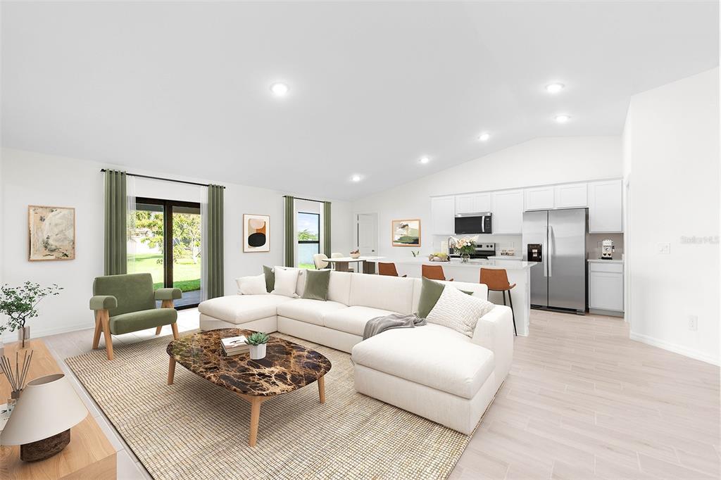 This is a digital rendering of an open-concept living room and kitchen with white cabinetry — 3510 E ELIAS CIRCLE, NORTH PORT, FL