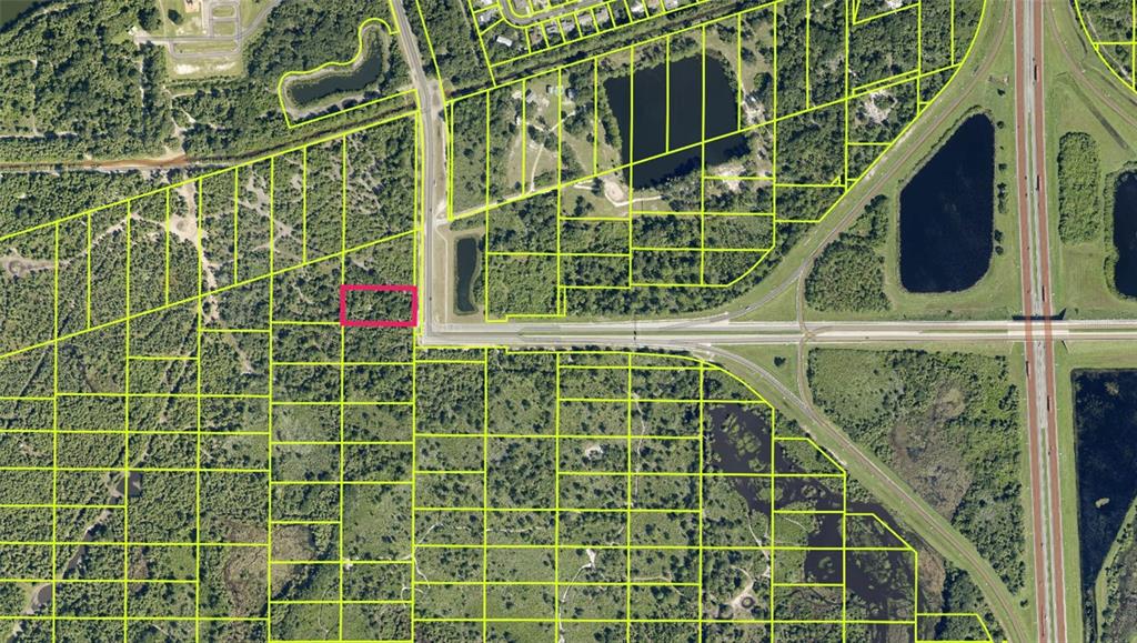 An aerial map shows a rectangular plot of land highlighted in pink near a highway — GOLFVIEW AVE, COCOA, FL
