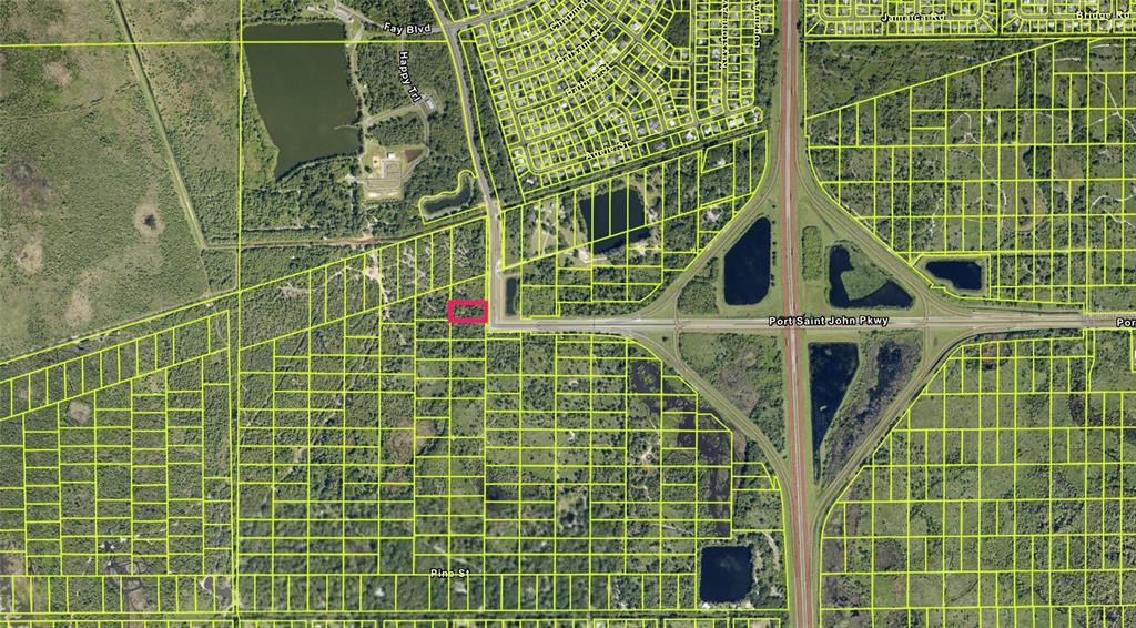 This is an aerial map showing a highlighted rectangular land parcel near a highway interchange — GOLFVIEW AVE, COCOA, FL