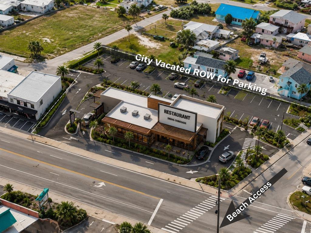 Aerial view of a restaurant with a drive-thru, parking lot, and adjacent beach access — 2000 S ATLANTIC AVENUE, DAYTONA BEACH, FL