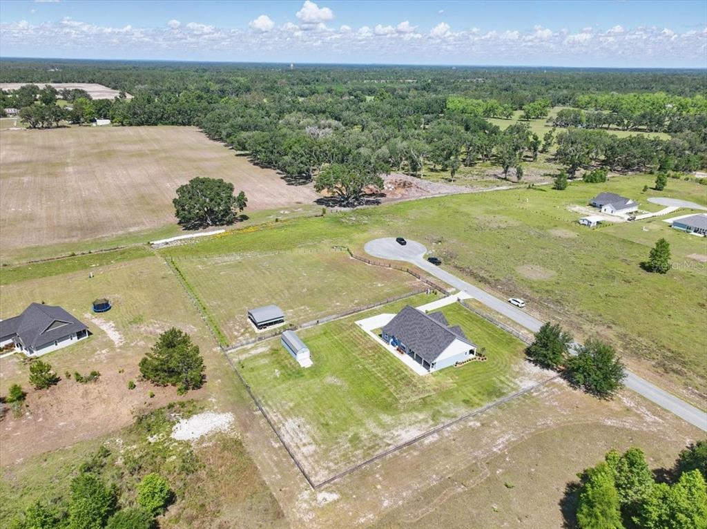 An aerial view shows a house with a fenced yard, outbuildings, and a cul-de-sac — 10172 98TH PATH, LIVE OAK, FL