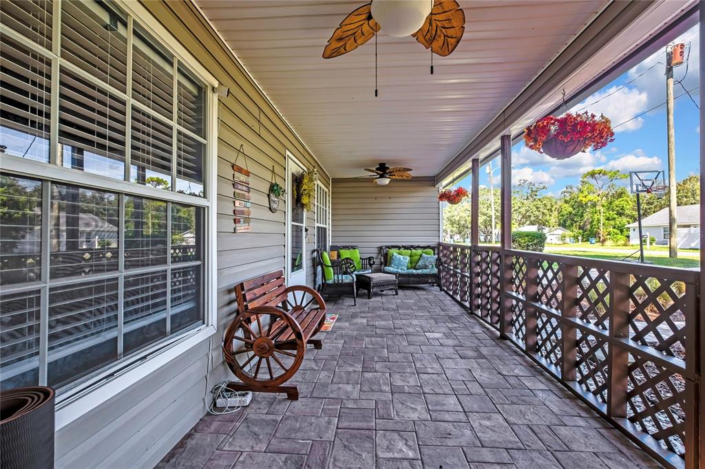 An aerial view shows a residential lot with a house and a large wooded area — 7484 SUSQUEHANNA TRAIL, SPRING HILL, FL