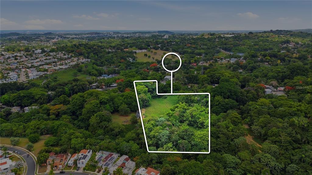 An aerial map view shows a highlighted vacant lot surrounded by trees and residential neighborhoods — PR 176 KM6.6 CUPEY ALTO, SAN JUAN, PR