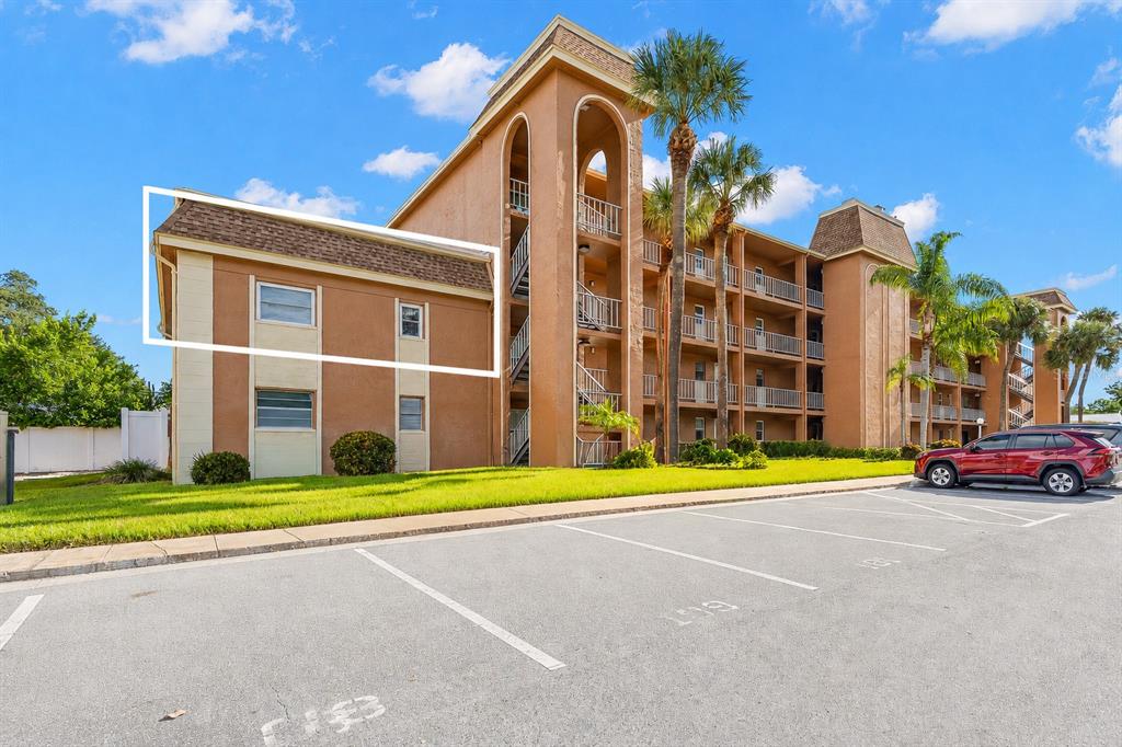 A multi-story apartment building with a highlighted section of exterior walls and windows — 12760 INDIAN ROCKS ROAD UNIT 107, LARGO, FL