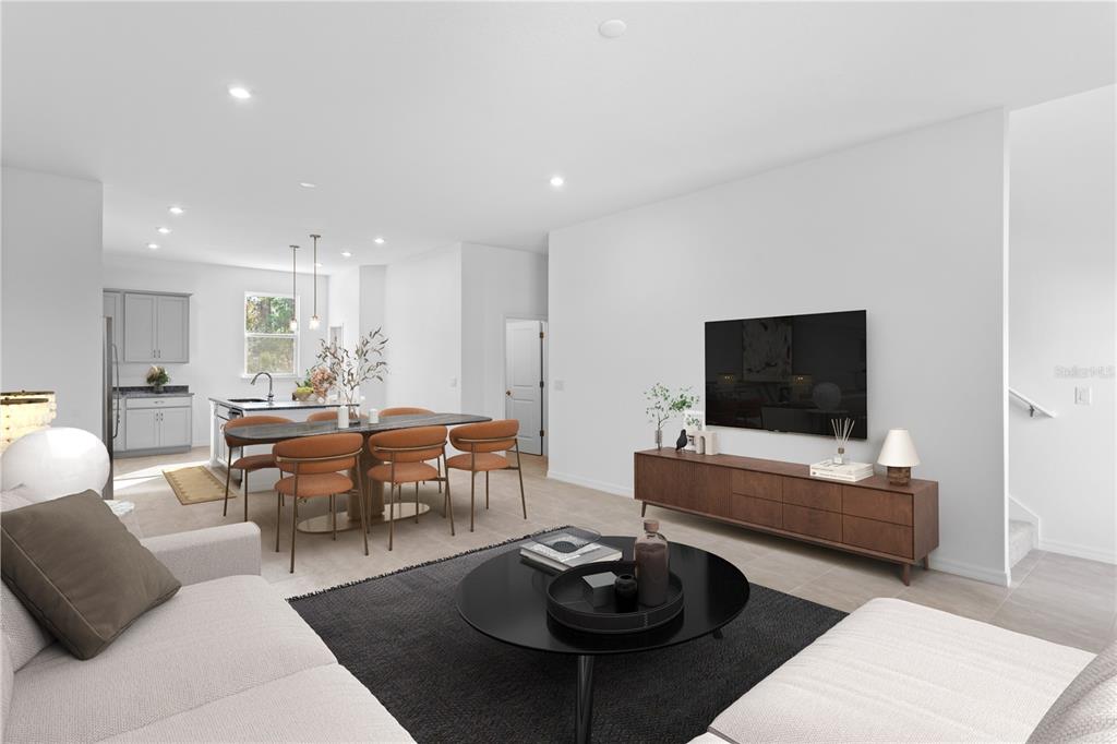 This is a digital rendering of an open-concept living and dining area with modern furniture — 9924 TATE LANE, WESTCHASE, FL