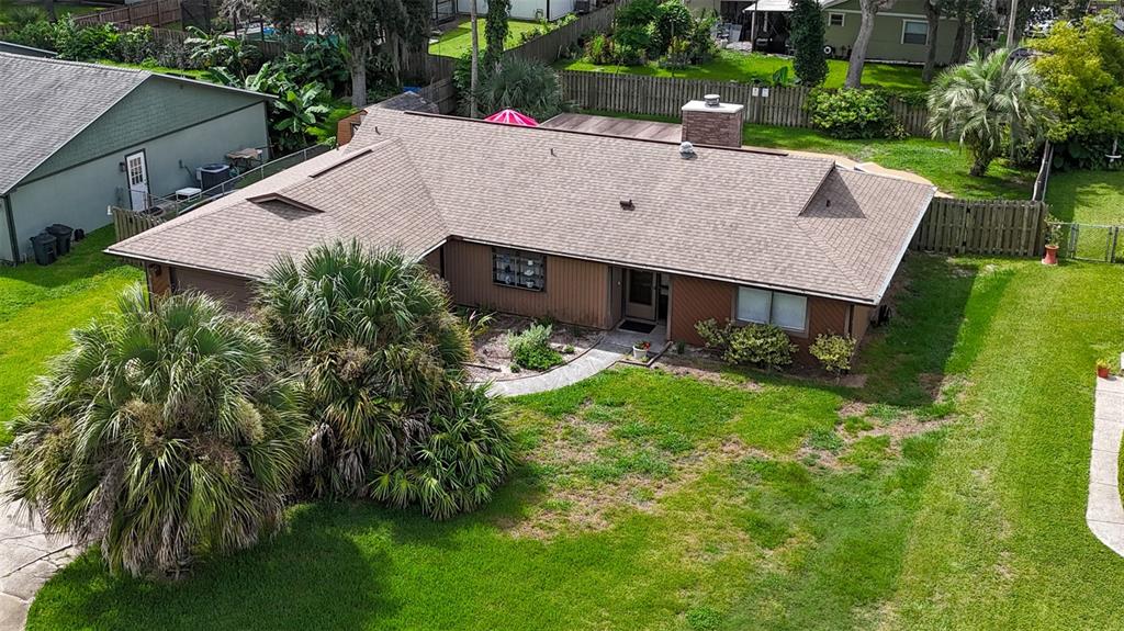 An aerial view of a single-story house with a brown roof and a large front yard — 608 TOUCHSTONE CIRCLE, PORT ORANGE, FL