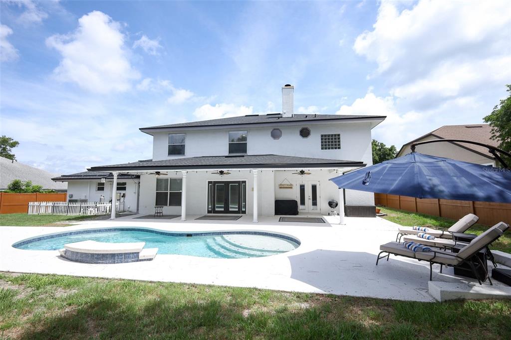The gated entrance to the Sweetwater West community features brick pillars and lush landscaping — 1349 VALLEY PINE CIRCLE, APOPKA, FL