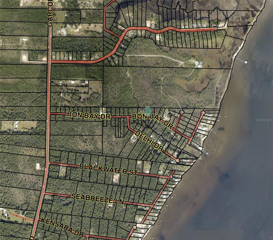 This is an aerial map showing residential lots, roads, and a waterfront area — BON BAY DRIVE, MILTON, FL