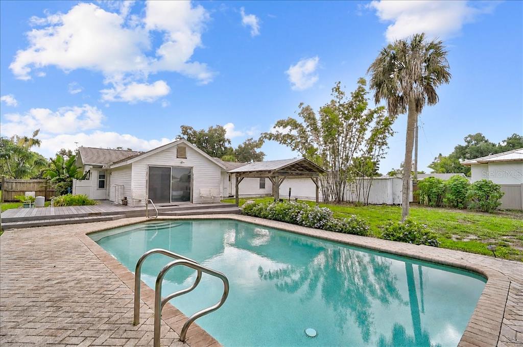 An aerial view shows a residential property outlined in red, featuring a house and pool — 2404 BISPHAM ROAD, SARASOTA, FL