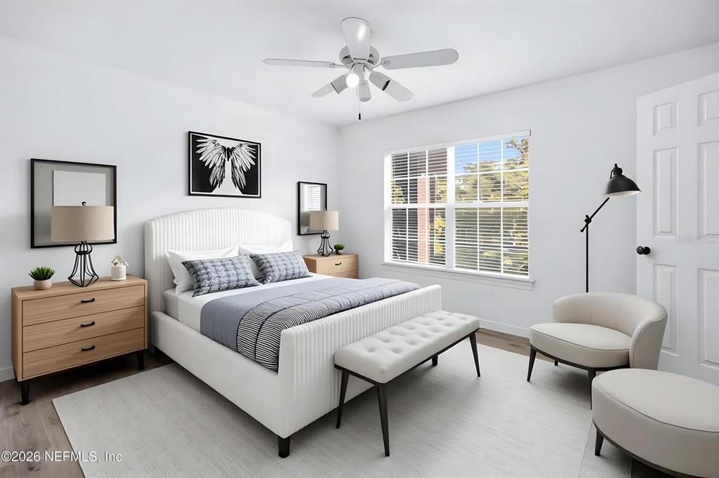 This is a digital rendering of a modern bedroom with a bed, bench, and chair — 7800 POINT MEADOWS DRIVE UNIT 737, JACKSONVILLE, FL