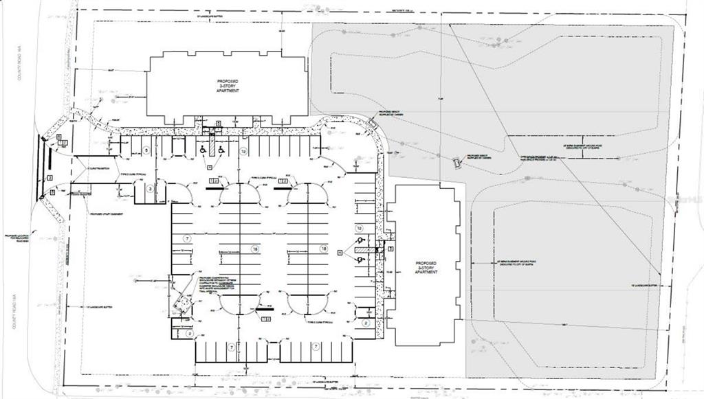 This site plan shows two proposed three-story apartment buildings with a central parking lot — 1925 COUNTY ROAD 19A, EUSTIS, FL