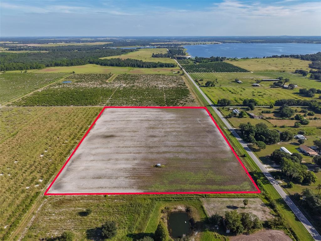 An aerial view shows a large, rectangular plot of cleared land outlined in red — DOC LINDSEY ROAD, FORT MEADE, FL