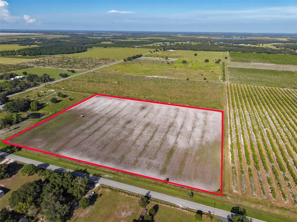 An aerial view shows a large, rectangular plot of cleared land outlined in red — DOC LINDSEY ROAD, FORT MEADE, FL