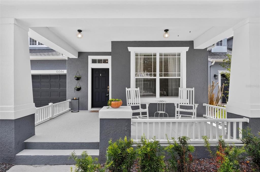 An aerial view of a blue house with a stone patio and fenced backyard — 13356 PHOENIX DRIVE, ORLANDO, FL