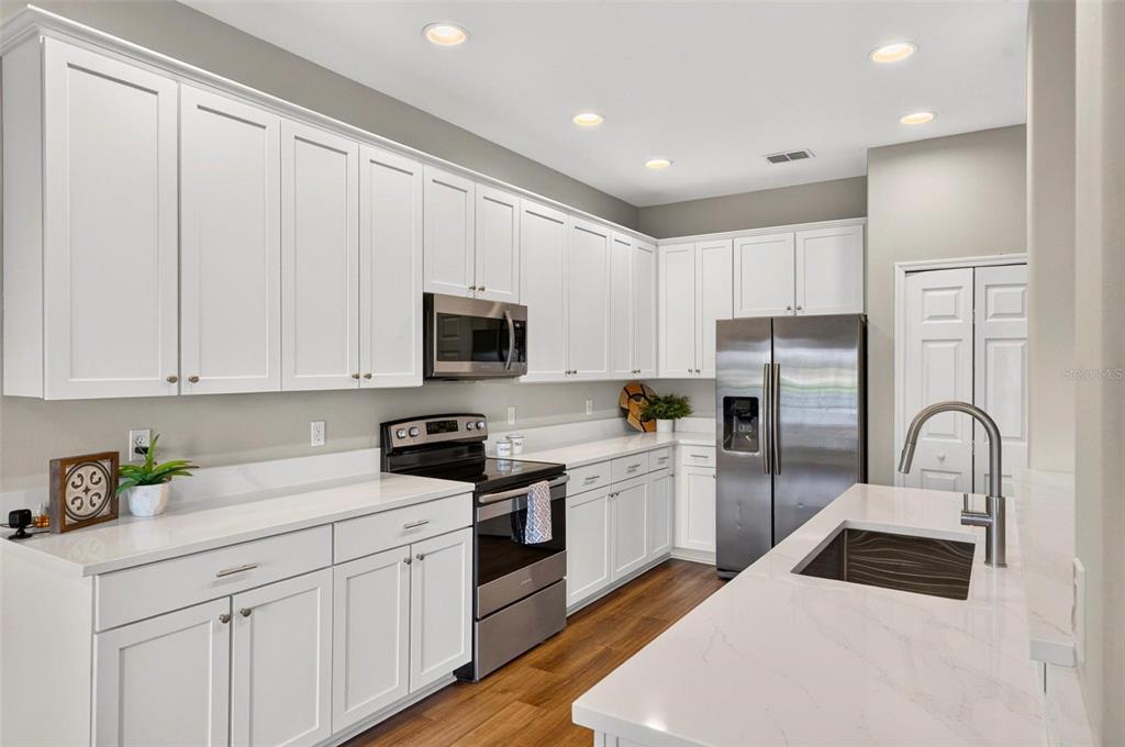 A gray single-family home features a two-car garage, a front porch, and a small lawn — 13356 PHOENIX DRIVE, ORLANDO, FL
