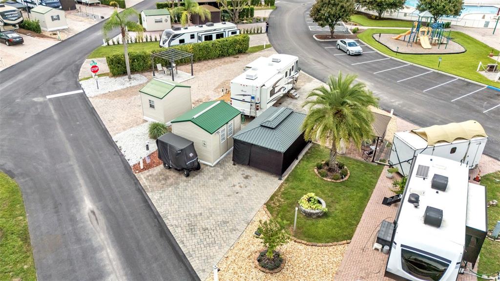 An aerial view shows a paved RV site with a shed, gazebo, and parked campers — 16414 BAY STREET, CLERMONT, FL