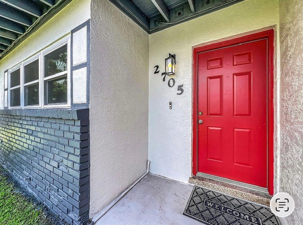 A single-story house with a brick and white exterior, a garage, and a large lawn — 2705 GULFSTREAM ROAD, ORLANDO, FL
