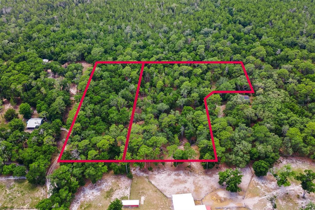 An aerial view shows a wooded lot outlined in red next to a rural property — SE 152ND - LOT 17 (RAVENSWOOD RD) PARCEL C PLACE, ALTOONA, FL