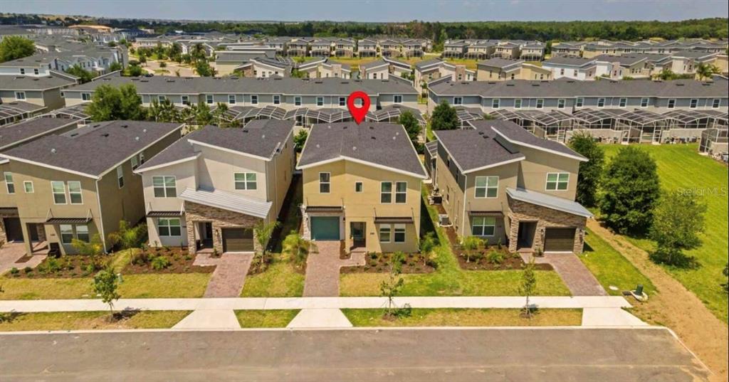 A screened-in patio features a swimming pool, a hot tub, and two lounge chairs — 8907 PLAY THROUGH DRIVE, DAVENPORT, FL