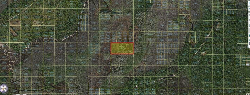 This is an aerial map showing a highlighted rectangular land parcel amidst a grid layout — HOLOPAW GROVES ROAD, ST CLOUD, FL