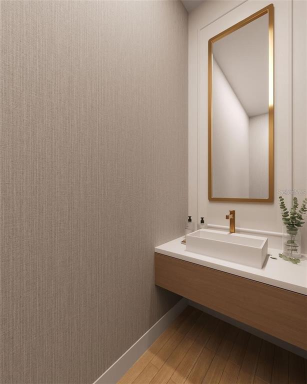 This rendering shows a modern powder room with a floating vanity, vessel sink, and mirror — 611 SIGLER DRIVE, WINTER GARDEN, FL