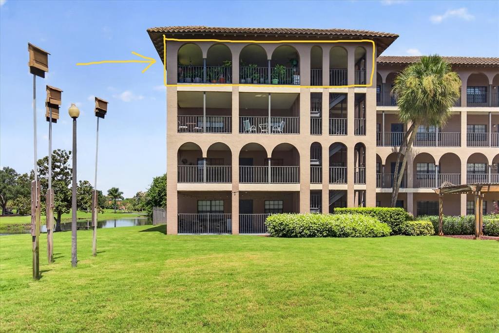 A sunset view over a calm body of water with several sailboats anchored in the distance — 6100 GULFPORT BOULEVARD S UNIT 401, GULFPORT, FL