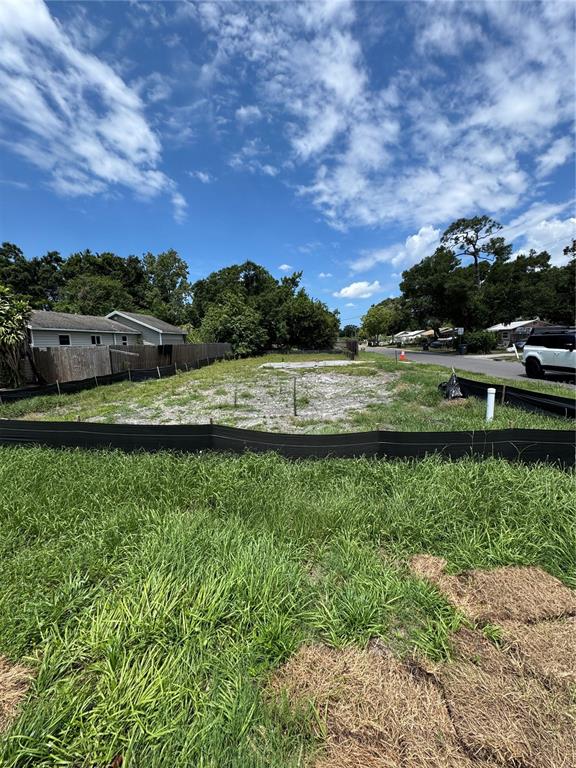A vacant residential lot with a silt fence and a concrete foundation slab — 4240 40TH STREET N, ST PETERSBURG, FL