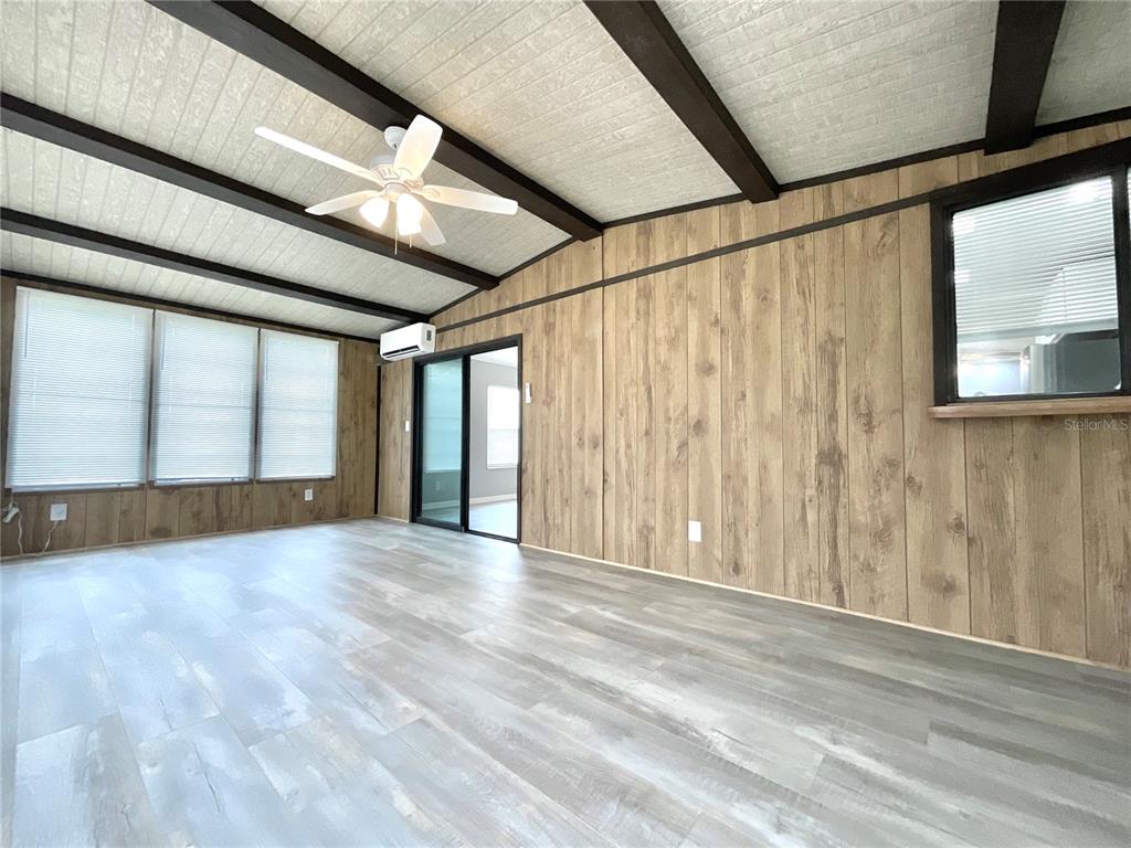 A kitchen features white cabinets, light countertops, a stainless steel sink, and a dishwasher — 2612 MCDANIEL DRIVE, KISSIMMEE, FL