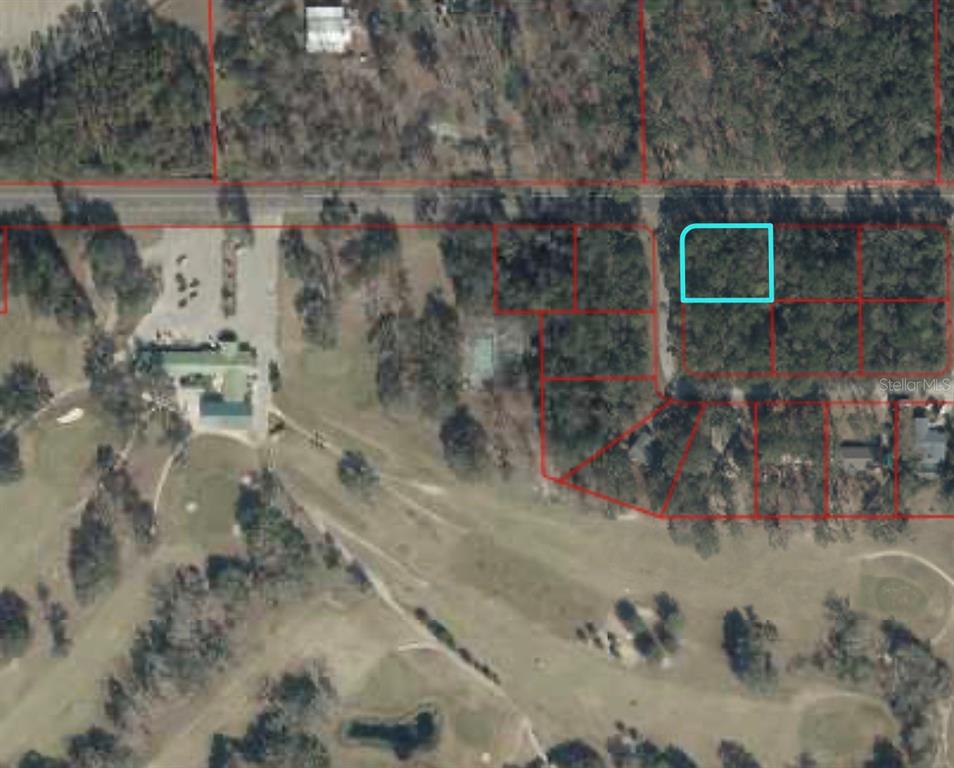 This is an aerial map showing a highlighted vacant lot within a residential neighborhood — TBD NW 94TH TER, CHIEFLAND, FL