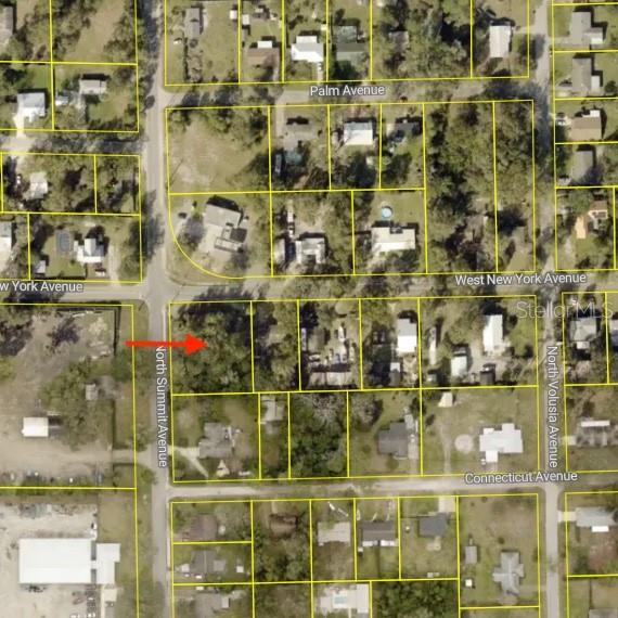 This is an aerial map showing a vacant lot highlighted by a red arrow — 281 N SUMMIT AVENUE, LAKE HELEN, FL