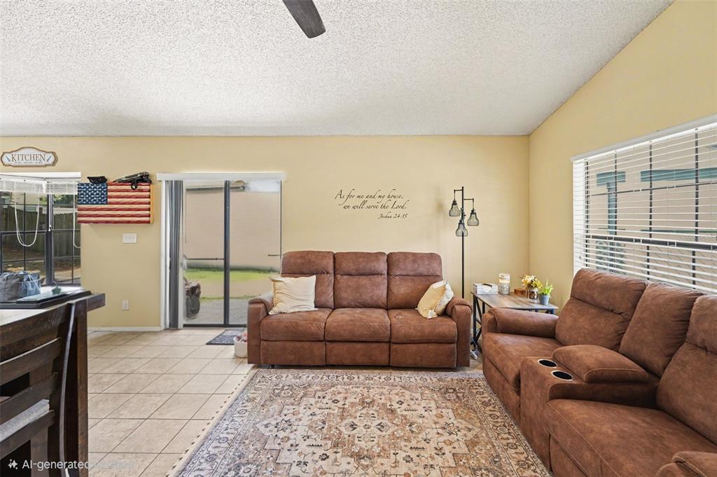A living room features two brown sofas, a patterned area rug, and yellow walls — 516 SHERIDAN DRIVE, PALM HARBOR, FL