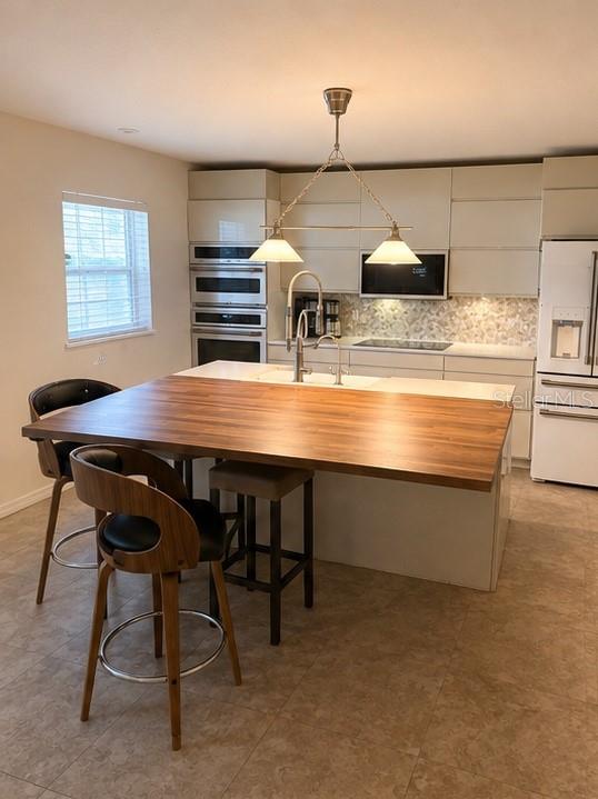 A bedroom features two beds, a desk with a gaming chair, and a tall bookshelf — 528 STONEWALL AVENUE, HAINES CITY, FL