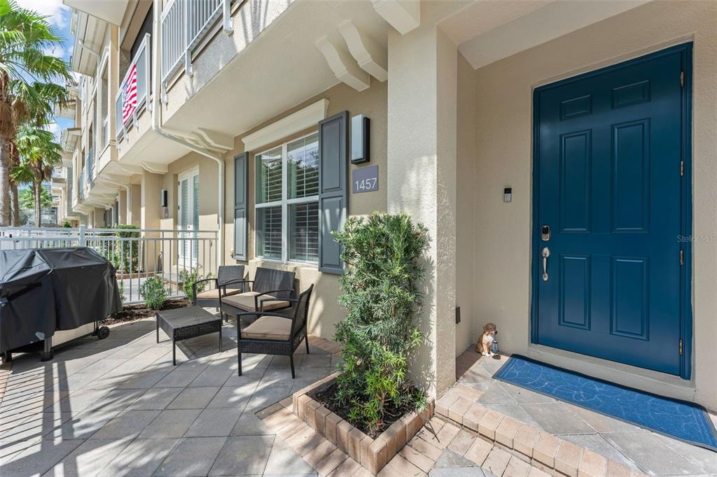 A home office features a multi-monitor desk setup, tile flooring, and an attached bathroom — 1457 LAKE GEORGE DRIVE UNIT 1457, LAKE MARY, FL