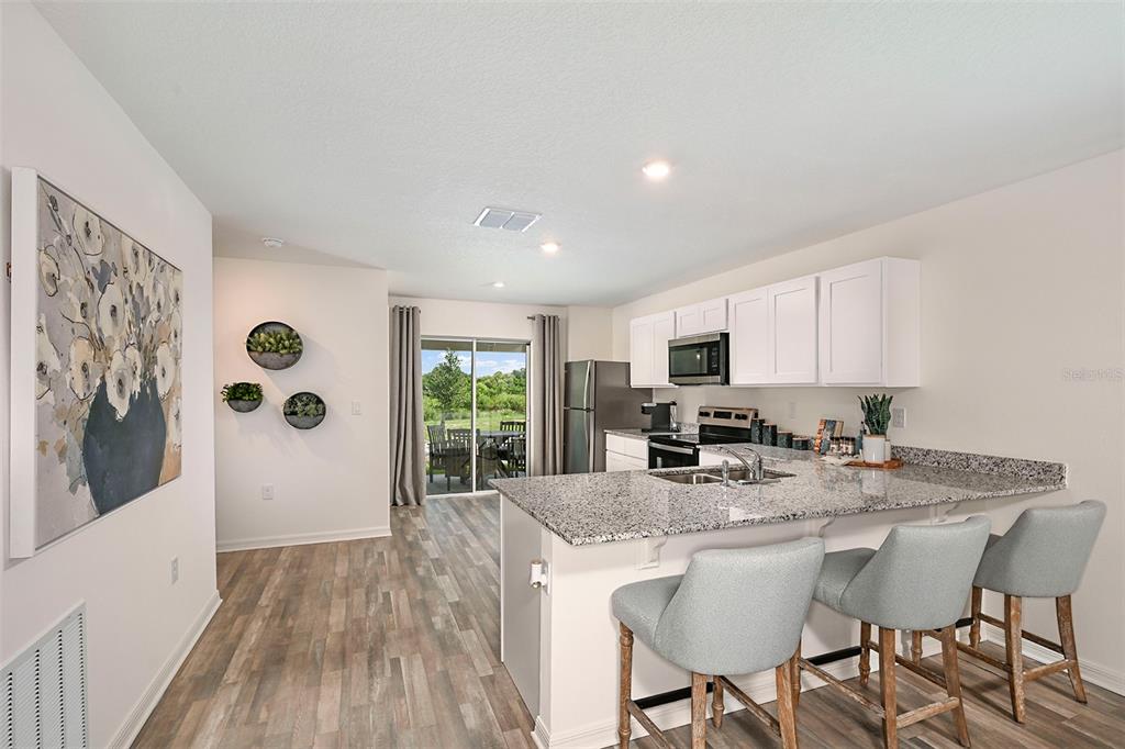 This image lists the exterior and interior features of a home in bulleted text — 1745 EAGLE HAMMOCK BOULEVARD, EAGLE LAKE, FL