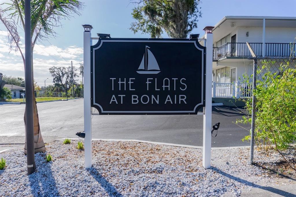 A black sign with a sailboat icon reads The Flats at Bon Air outdoors — 515 BON AIR STREET UNIT 1A, LAKELAND, FL