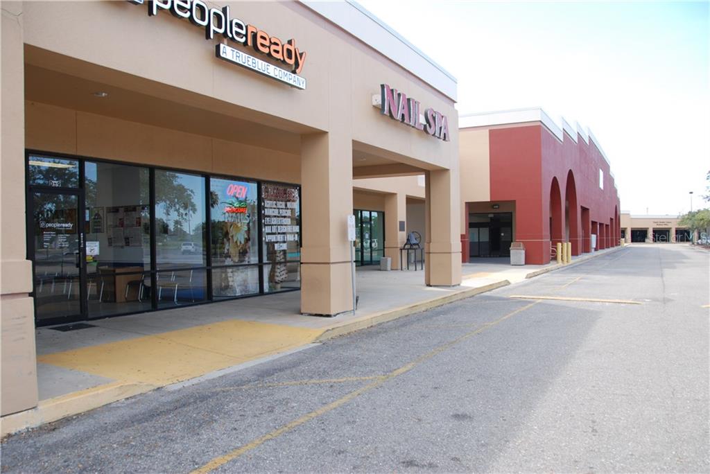 A view of a commercial strip mall exterior with a PeopleReady office and nail spa — 4300 KINGS HIGHWAY UNIT 409,,411,412,413,414,415, PORT CHARLOTTE, FL